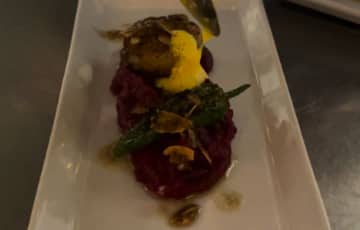 Fried scallop on beet puree with almonds